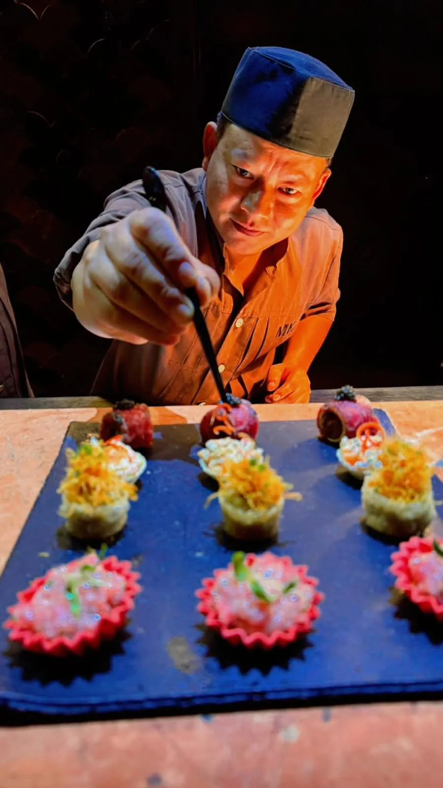 Executive Chef Ramesh Shah plating canapés